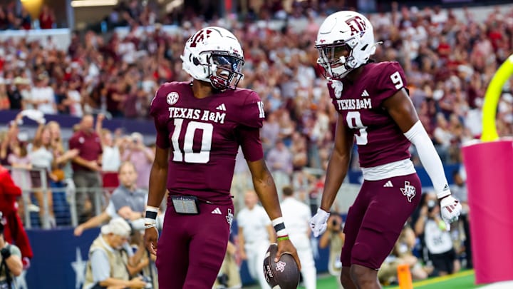 Sep 28, 2024; Arlington, Texas, USA; Texas A&M Aggies quarterback Marcel Reed (10) celebrates with receiver Jahdae Walker (9) after scoring a touchdown during the first half against the Arkansas Razorbacks at AT&T Stadium. Sep 28, 2024; Arlington, Texas, USA; Texas A&M Aggies quarterback Marcel Reed (10) celebrates with receiver Jahdae Walker (9) after scoring a touchdown during the first half against the Arkansas Razorbacks at AT&T Stadium.