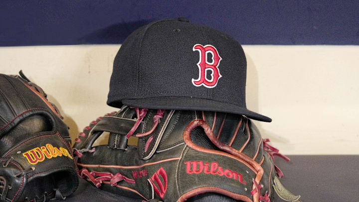 May 27, 2025; Milwaukee, Wisconsin, USA; A Boston Red Sox hat and glove sit in the dug out before a game against the Milwaukee Brewers at American Family Field. Mandatory Credit: Michael McLoone-Imagn Images May 27, 2025; Milwaukee, Wisconsin, USA; A Boston Red Sox hat and glove sit in the dug out before a game against the Milwaukee Brewers at American Family Field. Mandatory Credit: Michael McLoone-Imagn Images