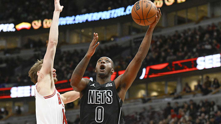 Dec 2, 2024; Chicago, Illinois, USA; Brooklyn Nets forward Dariq Whitehead (0) shoots against Chicago Bulls forward Matas Buzelis (14) during the second half at the United Center. Mandatory Credit: Matt Marton-Imagn Images