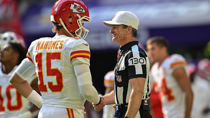 Kansas City Chiefs quarterback Patrick Mahomes shakes hands with referee Land Clark before a game against the Minnesota Vikings.