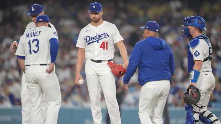 Aug 4, 2025; Los Angeles, California, USA;  Los Angeles Dodgers manager Dave Roberts (30) relieves Los Angeles Dodgers pitcher Brock Stewart (41) in the ninth inning during an MLB game against the St. Louis Cardinals at Dodger Stadium. Mandatory Credit: Kirby Lee-Imagn Images