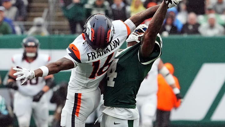 Sep 29, 2024; East Rutherford, New Jersey, USA; New York Jets cornerback D.J. Reed (4) defends against Denver Broncos wide receiver Troy Franklin (16) during the second half at MetLife Stadium. Sep 29, 2024; East Rutherford, New Jersey, USA; New York Jets cornerback D.J. Reed (4) defends against Denver Broncos wide receiver Troy Franklin (16) during the second half at MetLife Stadium.