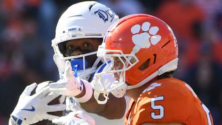 Duke Blue Devils tight end Landen King (0) celebrates after getting a first down while being defended by Clemson Tigers defensive back Ronan Hanafin (5) Saturday, Nov. 1, 2025, during the NCAA football game at Memorial Stadium in Clemson, South Carolina.