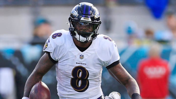 Baltimore Ravens quarterback Lamar Jackson (8) rushes for yards during the second quarter of a