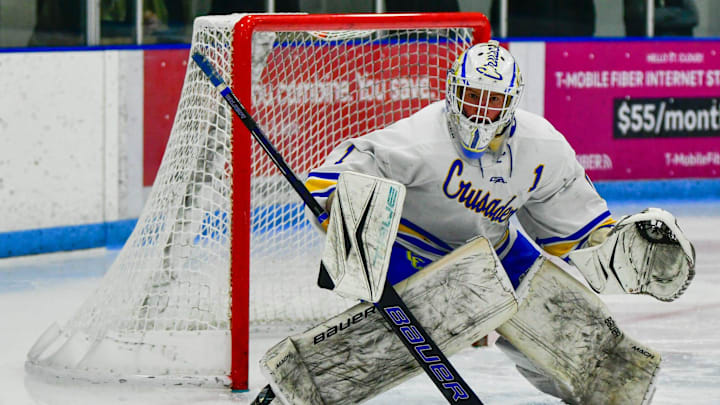 St. Cloud Cathedral hockey junior Keaton LeGrande guards the goal against Warroad in the 2024 season opener Nov. 23 at the Municipal Athletic Complex. The Crusaders and Warriors tied 2-2.