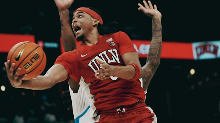 UNLV’s Howie Fleming Jr. (3) lays up the ball against the Memphis Tigers during a basketball game