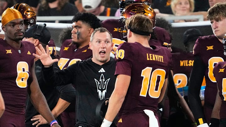 Arizona State Sun Devils head coach Kenny Dillingham talks to quarterback Sam Leavitt (10) against the Utah Utes in the first half at Mountain America Stadium.