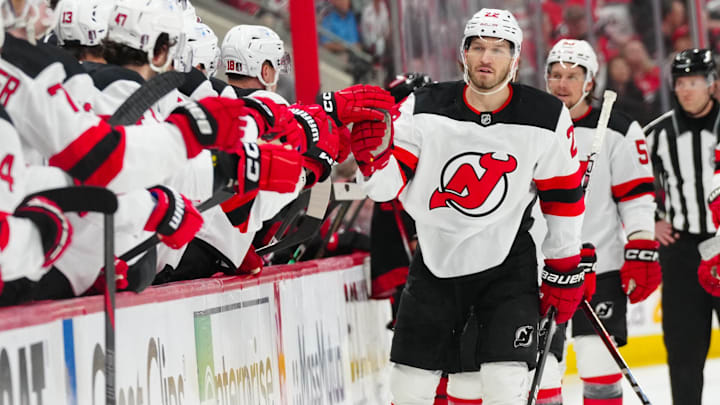 Apr 29, 2025; Raleigh, North Carolina, USA; New Jersey Devils defenseman Brett Pesce (22) celebrates his goal against the Carolina Hurricanes during the first period in game five of the first round of the 2025 Stanley Cup Playoffs at Lenovo Center. Mandatory Credit: James Guillory-Imagn Images Apr 29, 2025; Raleigh, North Carolina, USA; New Jersey Devils defenseman Brett Pesce (22) celebrates his goal against the Carolina Hurricanes during the first period in game five of the first round of the 2025 Stanley Cup Playoffs at Lenovo Center. Mandatory Credit: James Guillory-Imagn Images