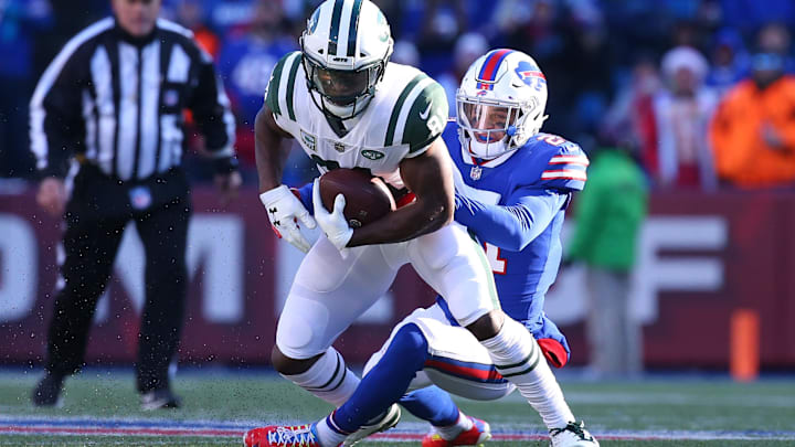 Dec 9, 2018; Orchard Park, NY, USA; Buffalo Bills free safety Jordan Poyer (21) tackles New York Jets wide receiver Quincy Enunwa (81) during the second quarter at New Era Field. 