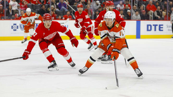 Feb 23, 2025; Detroit, Michigan, USA; Anaheim Ducks center Trevor Zegras (11) handles the puck during the first period of the game between the Detroit Red Wings and the Anaheim Ducks at Little Caesars Arena. Mandatory Credit: Brian Bradshaw Sevald-Imagn Images