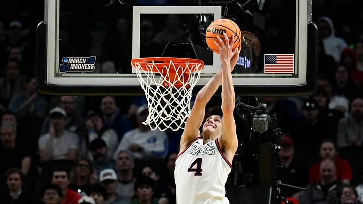 Mar 19, 2026; Portland, OR, USA; Gonzaga Bulldogs guard Davis Fogle (4) dunks against Kennesaw State Owls guard Kaden Rickard (4) during the second half of a first round game of the men's 2026 NCAA Tournament at Moda Center. Mar 19, 2026; Portland, OR, USA; Gonzaga Bulldogs guard Davis Fogle (4) dunks against Kennesaw State Owls guard Kaden Rickard (4) during the second half of a first round game of the men's 2026 NCAA Tournament at Moda Center.