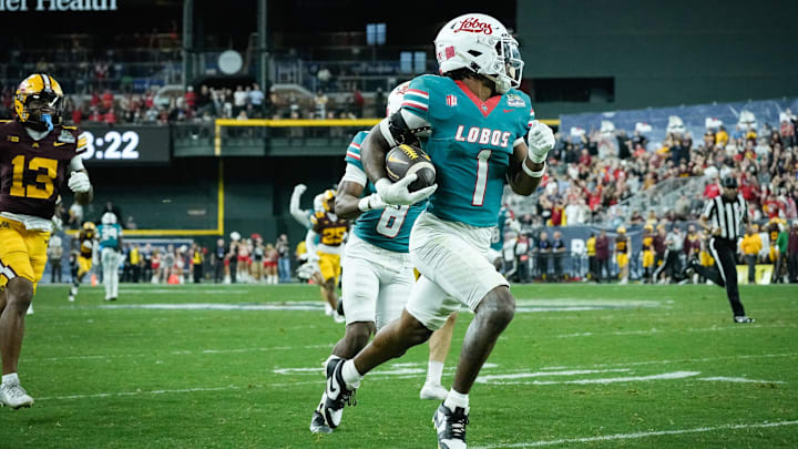 Keyshawn James-Newby (1) of the New Mexico Lobos runs toward the end zone for a touchdown against the Minnesota Golden Gophers at the 2025 Rate Bowl at Chase Field on Dec. 26, 2025, in Phoenix.