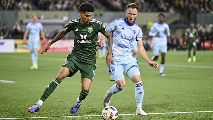 Feb 24, 2024; Portland, Oregon, USA; Portland Timbers forward Antony (11) steals the ball away from Colorado Rapids defender Keegan Rosenberry (2) during the second half at Providence Park. Mandatory Credit: Troy Wayrynen-USA TODAY Sports