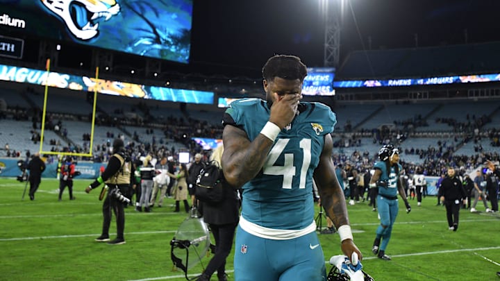 Jacksonville Jaguars linebacker Josh Allen (41) wipes his face as he walks off the field after Jacksonville Jaguars linebacker Josh Allen (41) wipes his face as he walks off the field after