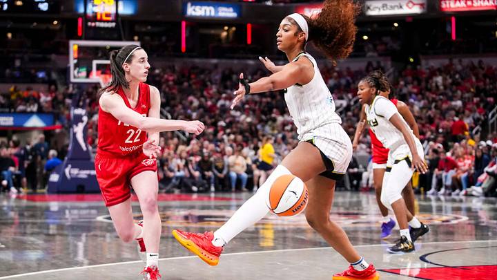 Indiana Fever guard Caitlin Clark (22) passes around Chicago Sky forward Angel Reese (5) on Saturday, May 17, 2025, during a game between the Indiana Fever and the Chicago Sky at Gainbridge Fieldhouse in Indianapolis. The Indiana Fever defeated the Chicago Sky, 93-58.