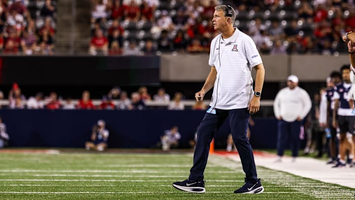 Aug 30, 2025; Tucson, Arizona, USA; Arizona Wildcats head coach Brent Brennan watches the game from the sidelines during the first quarter against the Hawaii Rainbow Warriors at Arizona Stadium. Mandatory Credit: Aryanna Frank-Imagn Images