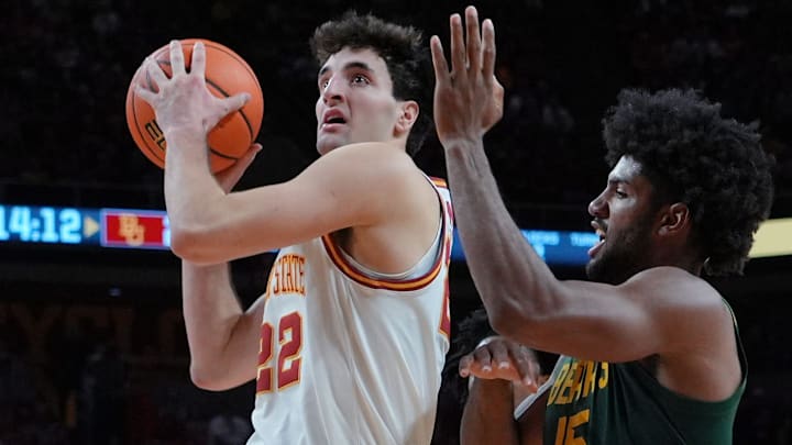 Iowa State Cyclones forward Milan Momcilovic (22) drives with the ball o the basket around Baylor Bears forward Norchad Omier (15) during the second half in the NCAA men’s basketball at Hilton Coliseum on Saturday, Jan. 4, 2025, in Ames, Iowa. Iowa State Cyclones forward Milan Momcilovic (22) drives with the ball o the basket around Baylor Bears forward Norchad Omier (15) during the second half in the NCAA men’s basketball at Hilton Coliseum on Saturday, Jan. 4, 2025, in Ames, Iowa.