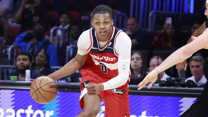 Apr 13, 2025; Miami, Florida, USA;  Miami Heat guard Jaime Jaquez Jr. (11) defends Washington Wizards guard Bub Carrington (8) during the second half at Kaseya Center. Mandatory Credit: Rhona Wise-Imagn Images