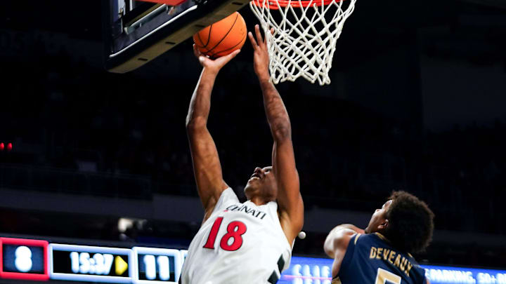 Cincinnati Bearcats forward Baba Miller (18) hits a layup in the first half of a NCAA men’s basketball game between the Cincinnati Bearcats and Mount St. Mary’s Mountaineers, Sunday, Nov. 16, 2025, at Fifth Third Arena in Cincinnati.