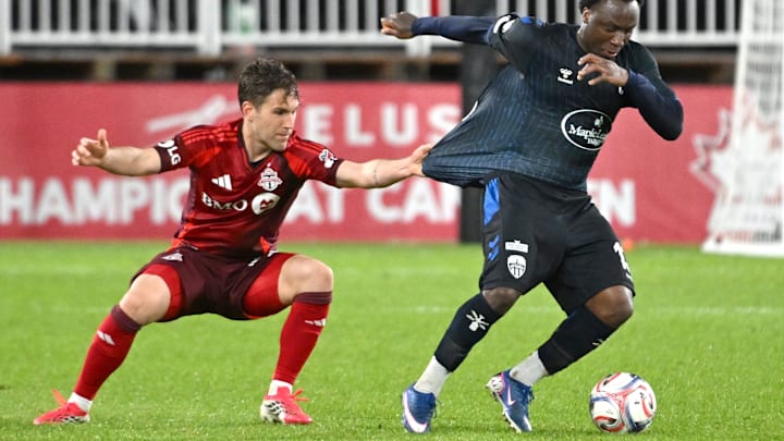 Atletico Ottawa midfielder Ballou Tabla has his shirt pulled as he tries to elude Toronto FC defender Jackson Gilman. Unfortunately, TFC did not elude the upset on Tuesday night. Atletico Ottawa midfielder Ballou Tabla has his shirt pulled as he tries to elude Toronto FC defender Jackson Gilman. Unfortunately, TFC did not elude the upset on Tuesday night.