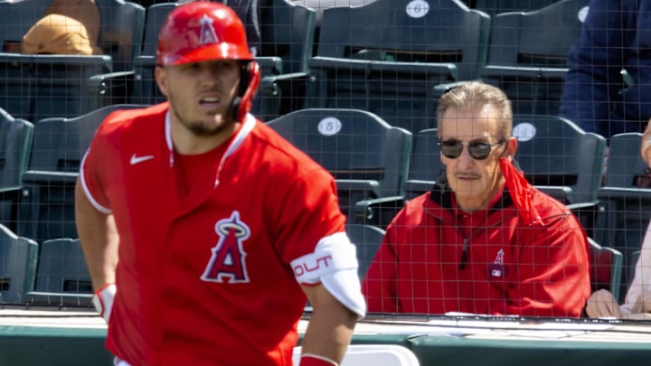 Mar 16, 2021; Tempe, Arizona, USA; Los Angeles Angels owner Arte Moreno (right) and outfielder Mike Trout against the Cleveland Indians during a Spring Training game at Tempe Diablo Stadium. Mandatory Credit: Mark J. Rebilas-Imagn Images