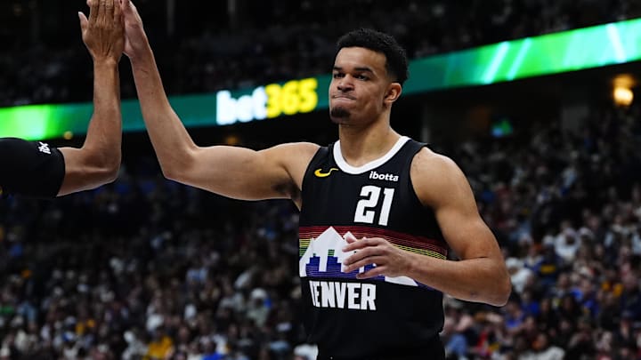 Dec 25, 2025; Denver, Colorado, USA; Denver Nuggets forward Spencer Jones (21) reacts against the Minnesota Timberwolves during the second half at Ball Arena. Mandatory Credit: Ron Chenoy-Imagn Images