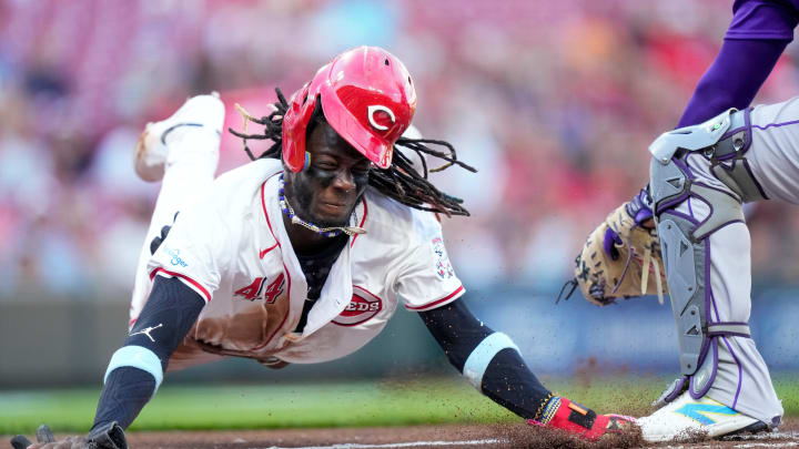Cincinnati Reds shortstop Elly De La Cruz (44) dives across home plate on a steal attempt but is tagged out by Colorado Rockies catcher Elias Díaz (35) for the final out of the first inning of the MLB National League game between the Cincinnati Reds and the Colorado Rockies at Great American Ball Park in downtown Cincinnati on Monday, July 8, 2024. The score was 0-0 after three innings. Cincinnati Reds shortstop Elly De La Cruz (44) dives across home plate on a steal attempt but is tagged out by Colorado Rockies catcher Elias Díaz (35) for the final out of the first inning of the MLB National League game between the Cincinnati Reds and the Colorado Rockies at Great American Ball Park in downtown Cincinnati on Monday, July 8, 2024. The score was 0-0 after three innings.