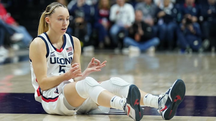 Jan 22, 2025; Storrs, Connecticut, USA; UConn Huskies guard Paige Bueckers (5) reacts after her three point basket and being fouled by the Villanova Wildcats in the first half at Harry A. Gampel Pavilion. Mandatory Credit: David Butler II-Imagn Images