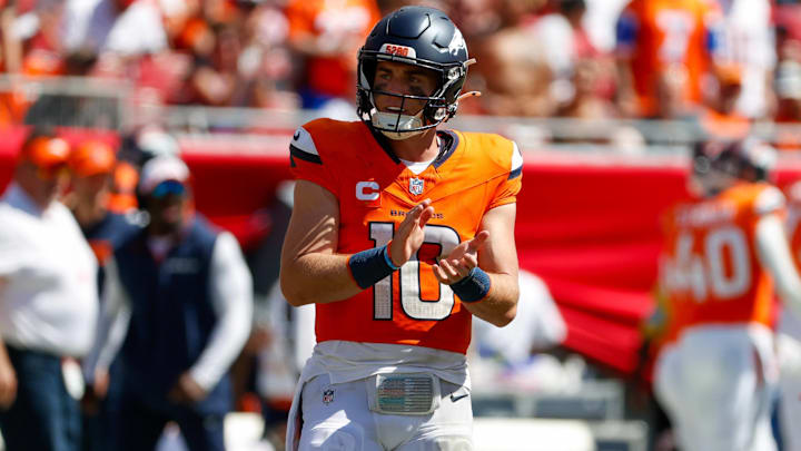 September 22, 2024, Tampa, Florida, USA: Denver Broncos quarterback Bo Nix (10) celebrates, after they get a first down against the Tampa Bay Buccaneers during the third quarter at Raymond James Stadium in Tampa on Sunday, Sept. 22, 2024. 