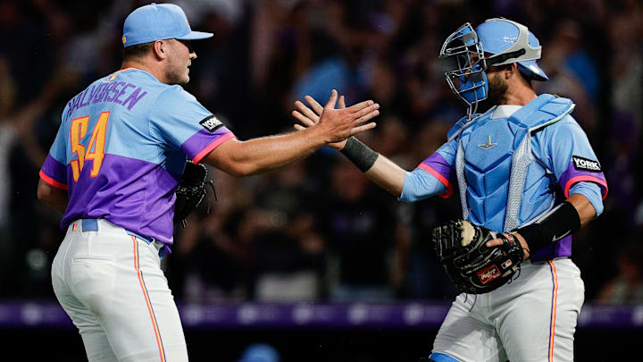 Jul 18, 2025; Denver, Colorado, USA; Colorado Rockies relief pitcher Seth Halvorsen (54) celebrates with catcher Austin Nola (20) after the game against the Minnesota Twins at Coors Field.