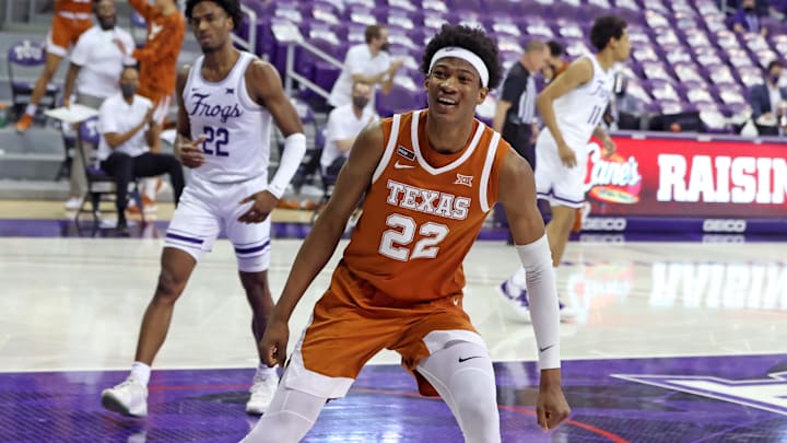 Mar 7, 2021; Fort Worth, Texas, USA;  Texas Longhorns forward Kai Jones (22) reacts after dunking during the second half against the TCU Horned Frogs at Ed and Rae Schollmaier Arena. Mandatory Credit: Kevin Jairaj-Imagn Images