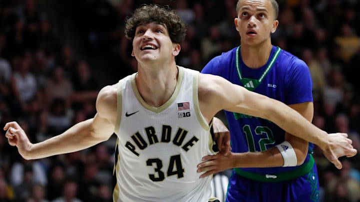 Purdue Boilermakers forward Raleigh Burgess (34) boxes out Purdue Boilermakers forward Raleigh Burgess (34) boxes out