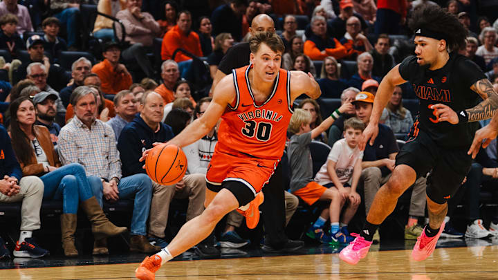 Virginia Cavaliers guard Dallin Hall and Miami Hurricanes guard Tre Donaldson 