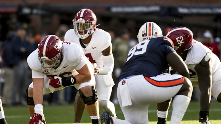 Nov 25, 2023; Auburn, Alabama, USA;  Alabama Crimson Tide quarterback Jalen Milroe (4) makes a call at the line of scrimmage during the game with Auburn at Jordan-Hare Stadium. Mandatory Credit: Gary Cosby Jr.-Imagn Images