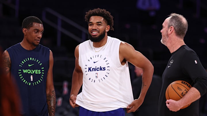 Oct 13, 2024; New York, New York, USA; New York Knicks center Karl-Anthony Towns (32), center, walks with Minnesota Timberwolves forward Jaden McDaniels (3), left, and assistant coach Kevin Hanson before the game at Madison Square Garden. Mandatory Credit: Vincent Carchietta-Imagn Images