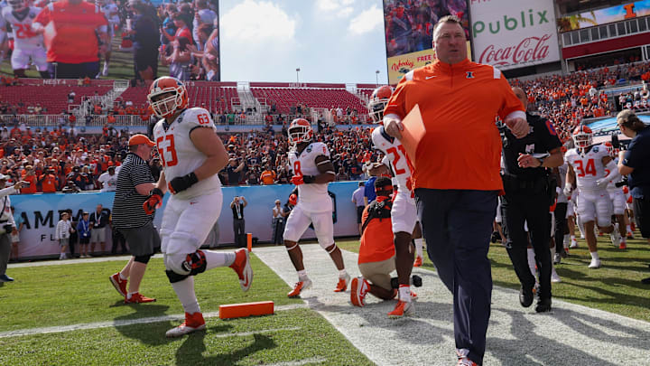 Jan 2, 2023; Tampa, FL, USA; Illinois Fighting Illini head coach Bret Bielema takes the field fro the the 2023 ReliaQuest Bowl against the Mississippi State Bulldogs at Raymond James Stadium. Mandatory Credit: Nathan Ray Seebeck-Imagn Images Jan 2, 2023; Tampa, FL, USA; Illinois Fighting Illini head coach Bret Bielema takes the field fro the the 2023 ReliaQuest Bowl against the Mississippi State Bulldogs at Raymond James Stadium. Mandatory Credit: Nathan Ray Seebeck-Imagn Images