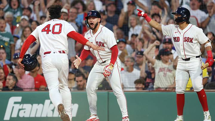 Jun 28, 2026; Boston, Massachusetts, USA; Boston Red Sox right fielder Wilyer Abreu (52) celebrates with Boston Red Sox first baseman Willson Contreras (40) after scoring during the during the fourth inning against the New York Yankees at Fenway Park. Mandatory Credit: Paul Rutherford-Imagn Images