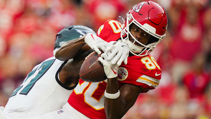 Sep 14, 2025; Kansas City, Missouri, USA; Kansas City Chiefs wide receiver Tyquan Thornton (80) catches a touchdown pass against Philadelphia Eagles cornerback Quinyon Mitchell (27) during the second half at GEHA Field at Arrowhead Stadium. Mandatory Credit: Jay Biggerstaff-Imagn Images