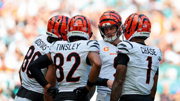 Dec 21, 2025; Miami Gardens, Florida, USA; Cincinnati Bengals quarterback Joe Burrow (9) talks to his teammates Cincinnati Bengals tight end Mike Gesicki (88), Cincinnati Bengals wide receiver Mitchell Tinsley (82) and Cincinnati Bengals wide receiver Ja'Marr Chase (1) after a play during the second quarter against the Miami Dolphins at Hard Rock Stadium. Mandatory Credit: Sam Navarro-Imagn Images Dec 21, 2025; Miami Gardens, Florida, USA; Cincinnati Bengals quarterback Joe Burrow (9) talks to his teammates Cincinnati Bengals tight end Mike Gesicki (88), Cincinnati Bengals wide receiver Mitchell Tinsley (82) and Cincinnati Bengals wide receiver Ja'Marr Chase (1) after a play during the second quarter against the Miami Dolphins at Hard Rock Stadium. Mandatory Credit: Sam Navarro-Imagn Images