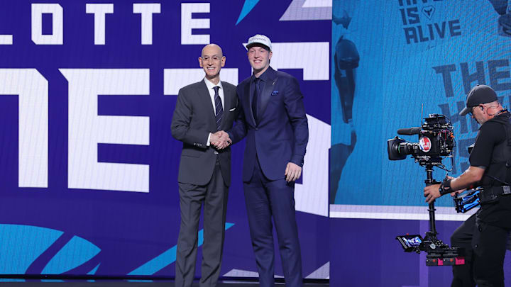 Jun 25, 2025; Brooklyn, NY, USA; Kon Knueppel stands with NBA commissioner Adam Silver after being selected as the fourth pick by the Charlotte Hornets in the first round of the 2025 NBA Draft at Barclays Center. Mandatory Credit: Brad Penner-Imagn Images Jun 25, 2025; Brooklyn, NY, USA; Kon Knueppel stands with NBA commissioner Adam Silver after being selected as the fourth pick by the Charlotte Hornets in the first round of the 2025 NBA Draft at Barclays Center. Mandatory Credit: Brad Penner-Imagn Images