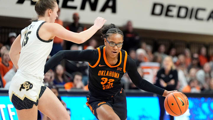 Oklahoma State guard Stailee Heard (32) drives to the basket as Colorado guard Kindyll Wetta (15) defends during the college basketball game between the Oklahoma State University Cowgirls and the Colorado Buffaloes, Saturday, Feb., 22, 2025. Oklahoma State guard Stailee Heard (32) drives to the basket as Colorado guard Kindyll Wetta (15) defends during the college basketball game between the Oklahoma State University Cowgirls and the Colorado Buffaloes, Saturday, Feb., 22, 2025.