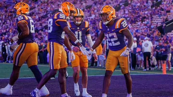 Oct 3, 2026; Baton Rouge, Louisiana, USA;  LSU Tigers running back Harlem Berry (22) celebrates a touchdown against the McNeese Cowboys during the second half at Tiger Stadium.  Mandatory Credit: Stephen Lew-Imagn Images