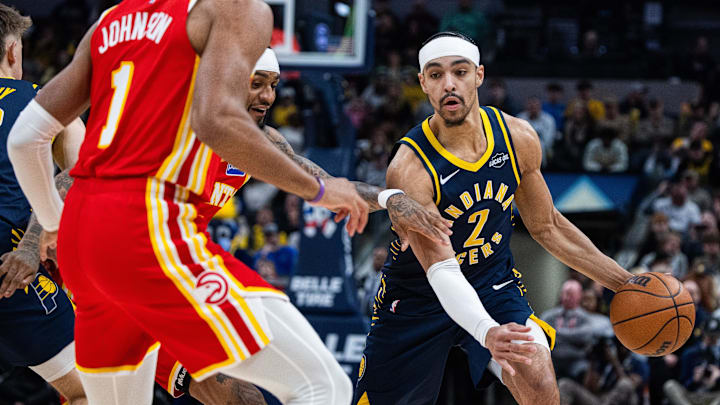 Jan 31, 2026; Indianapolis, Indiana, USA; Indiana Pacers guard/forward Andrew Nembhard (2) dribbles the ball while Atlanta Hawks guard Nickeil Alexander-Walker (7) defends in the first half at Gainbridge Fieldhouse. Mandatory Credit: Trevor Ruszkowski-Imagn Images