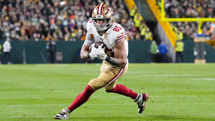 Nov 24, 2024; Green Bay, Wisconsin, USA; San Francisco 49ers tight end George Kittle (85) rushes with the football after catching a pass during the second quarter against the Green Bay Packers at Lambeau Field. Mandatory Credit: Jeff Hanisch-Imagn Images Nov 24, 2024; Green Bay, Wisconsin, USA; San Francisco 49ers tight end George Kittle (85) rushes with the football after catching a pass during the second quarter against the Green Bay Packers at Lambeau Field. Mandatory Credit: Jeff Hanisch-Imagn Images