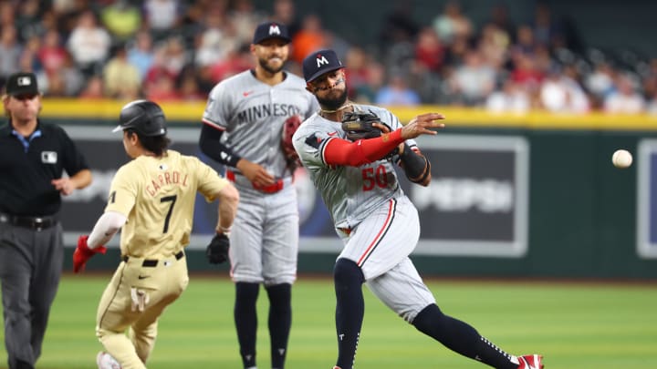 Jun 25, 2024; Phoenix, Arizona, USA; Minnesota Twins shortstop Willi Castro fields a ground ball in the seventh inning against the Arizona Diamondbacks at Chase Field. Mandatory Credit: Mark J. Rebilas-USA TODAY Sports