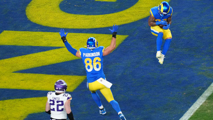 Jan 13, 2025; Glendale, AZ, USA; Los Angeles Rams running back Kyren Williams (23) makes a touchdown catch against the Minnesota Vikings during the first half in an NFC wild card game at State Farm Stadium. Mandatory Credit: Joe Camporeale-Imagn Images