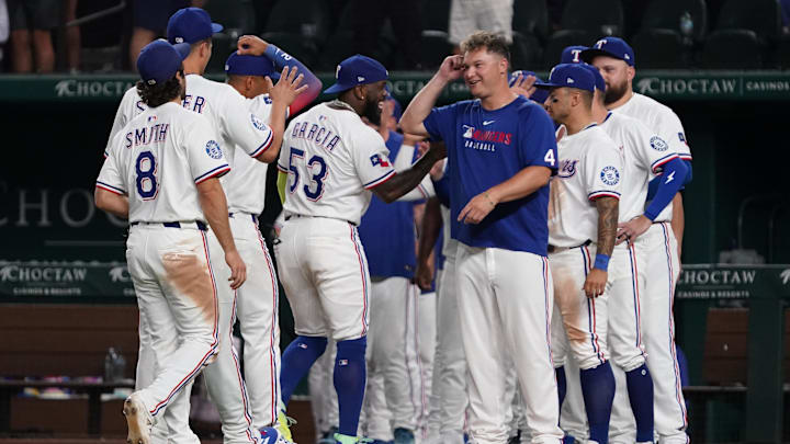 July 21, 2025; Arlington, Texas, USA; Texas Rangers outfielder Adolis García (53) celebrates with teammates following the game against the Athletics at Globe Life Field. 