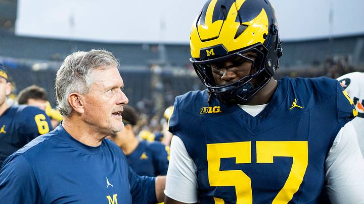 Michigan Wolverines head coach Kyle Whittingham speaks to defensive tackle Travis Moten (57) after defeating UTEP 52-17 at Michigan Stadium in Ann Arbor on Saturday, Sept. 19, 2026. Michigan Wolverines head coach Kyle Whittingham speaks to defensive tackle Travis Moten (57) after defeating UTEP 52-17 at Michigan Stadium in Ann Arbor on Saturday, Sept. 19, 2026.