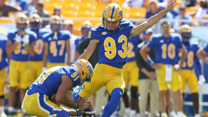 Aug 30, 2025; Pittsburgh, Pennsylvania, USA; Pittsburgh Panthers place kicker Trey Butkowski (93) kicks a field goal from the hold of punter Caleb Junko (91) against the Duquesne Dukes during the fourth quarter at Acrisure Stadium. Mandatory Credit: Charles LeClaire-Imagn Images