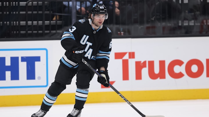Jan 16, 2025; Salt Lake City, Utah, USA; Utah Hockey Club left wing Matias Maccelli (63) skates with the puck against the New York Rangers during the first period at Delta Center. Mandatory Credit: Rob Gray-Imagn Images